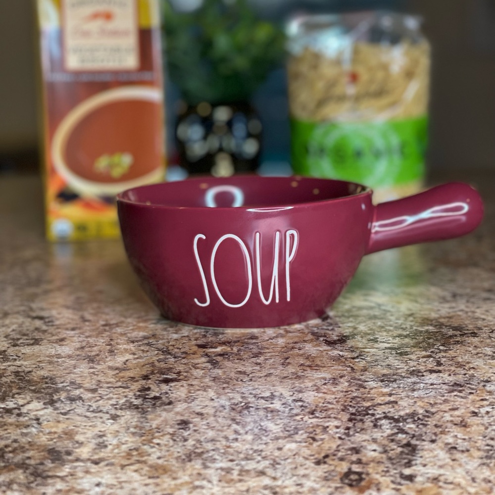 Rae Dunn “Soup” bowl w handle. Burgundy, white lettering, Microwave & Oven safe
